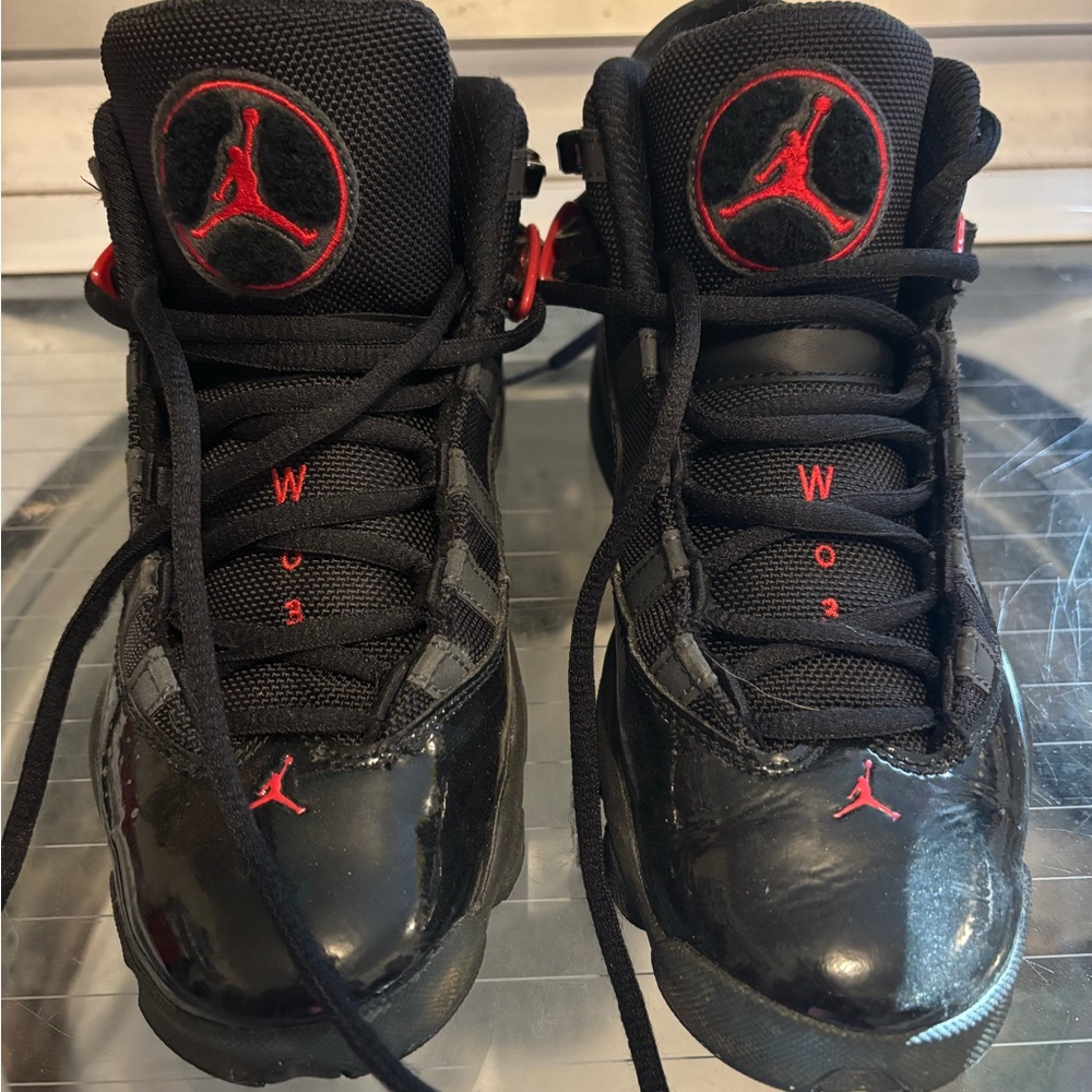 Kids Black and Red Nike Jordan sneakers